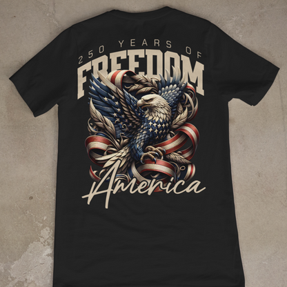 Black t-shirt with eagle and American flag design on a concrete floor