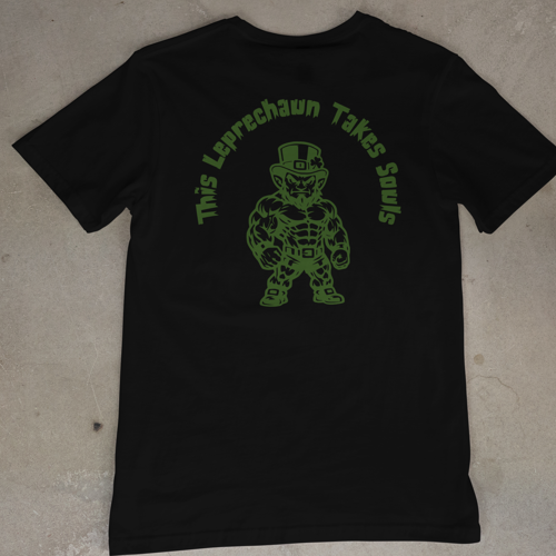 Black t-shirt with green graphic and text on a beige surface
